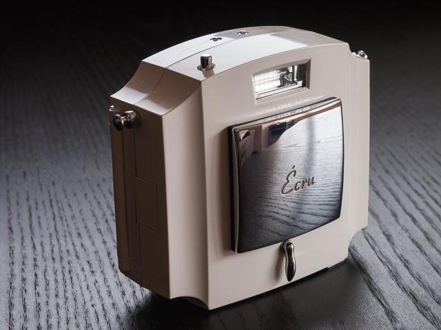 Olympus Ecru camera, lens cap on