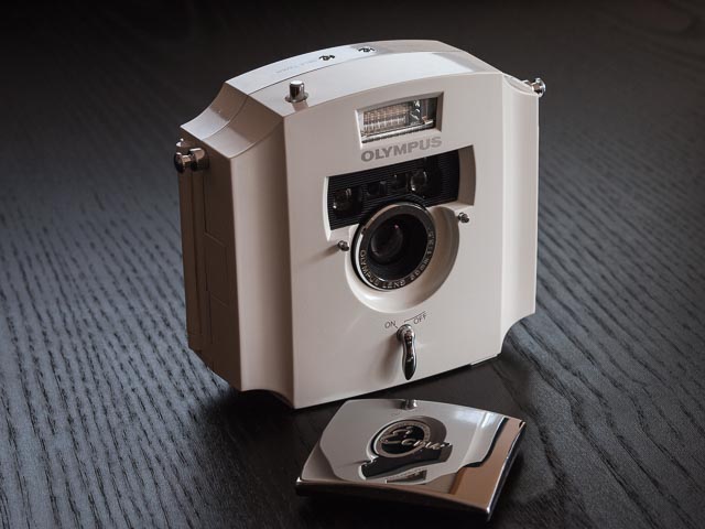 Olympus Ecru camera, lens cap off