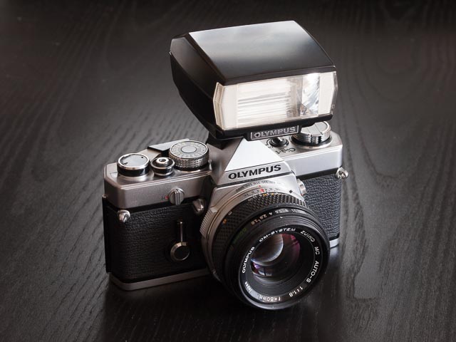 Olympus OM-1 camera fitted with the Olympus OM Zuiko MC Auto-S 50mm f/1.8 lens and T-20 flash unit
