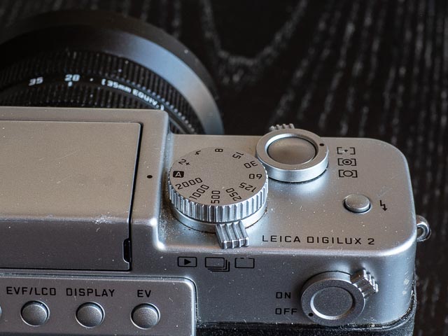 The bototm plate with the plastic battery compartment cover.