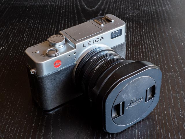 Leica Digilux 2 with lens hood and lens hood cap
