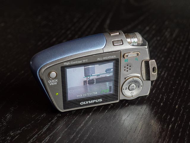 Olympus Mju Mini Digital S in blue, back and switched on